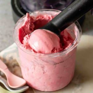 Close up of a scoop of raspberry froyo in a Ninja Creami pot