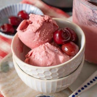 Close up of cherry froyo garnished with whole cherries