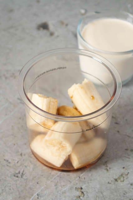 First the banana pieces maple syrup and vanilla paste are placed in the Ninja pot