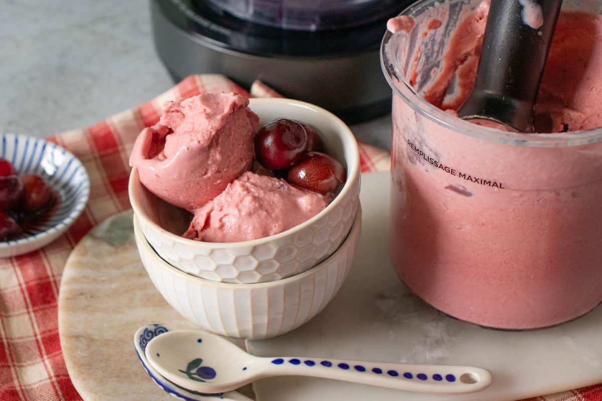 Close up of cherry froyo garnished with whole cherries