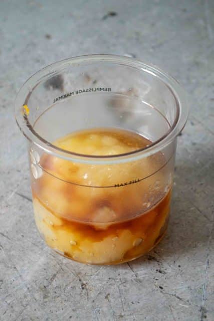 The apple puree maple syrup and lemon juice are added to the pot.