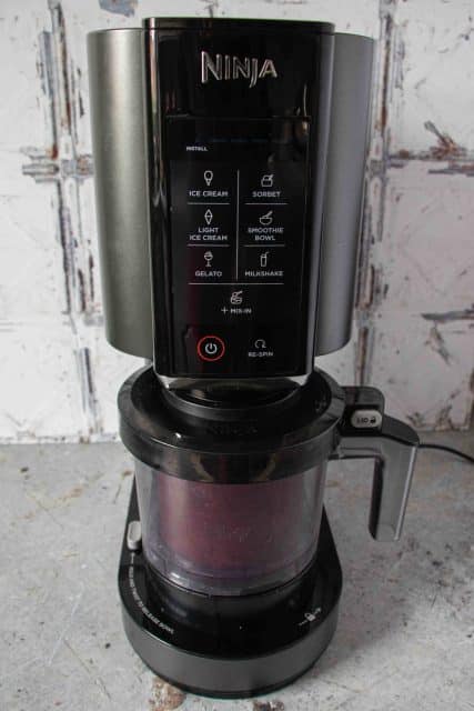 The Ninja Creami machine processing the sorbet