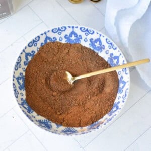 a blue and white bowl filled with the spice blend