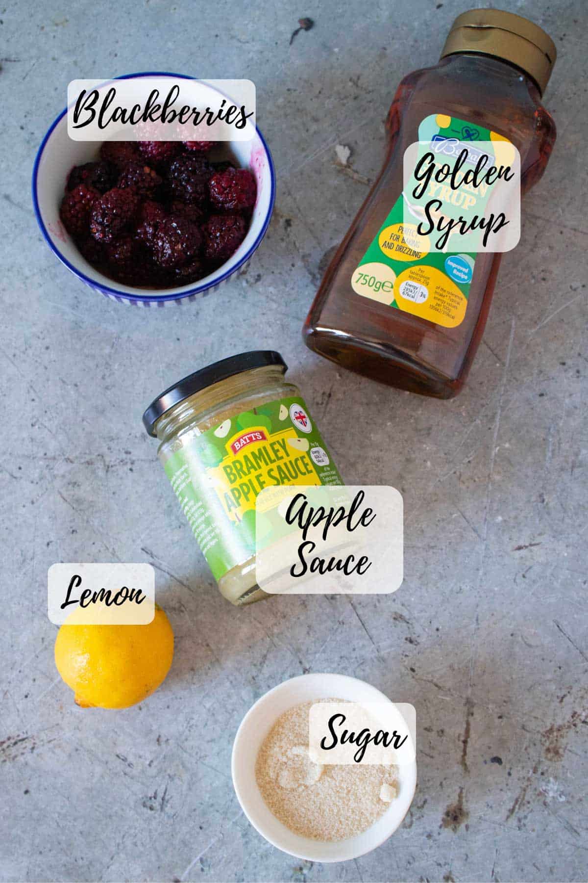 Ingredients are blackberries apple sauce lemon sugar and golden syrup