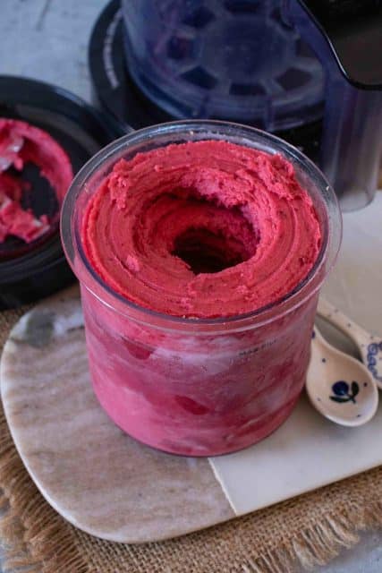 After respinning the sorbet has come together with a hole down the middle of the Ninja Creami pot and is ready to serve
