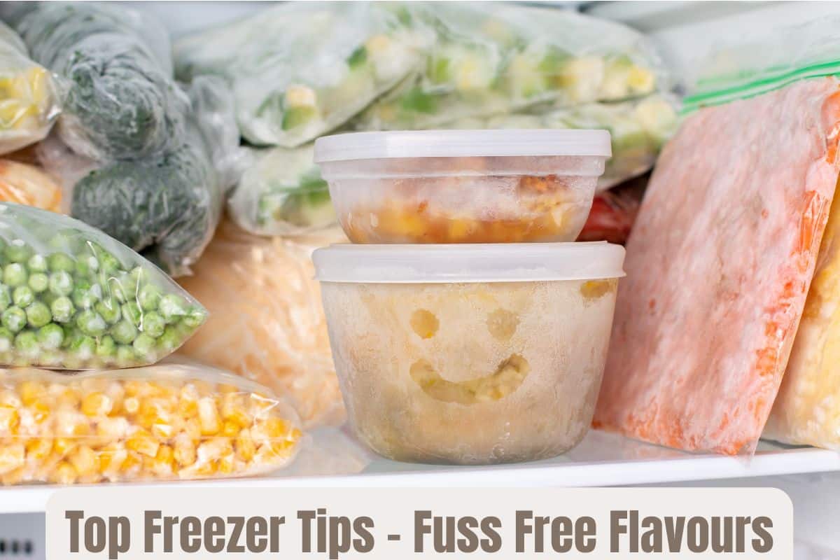 Two pots of soup in a freezer, with bags of frozen vegetables in the rest of the compartment.