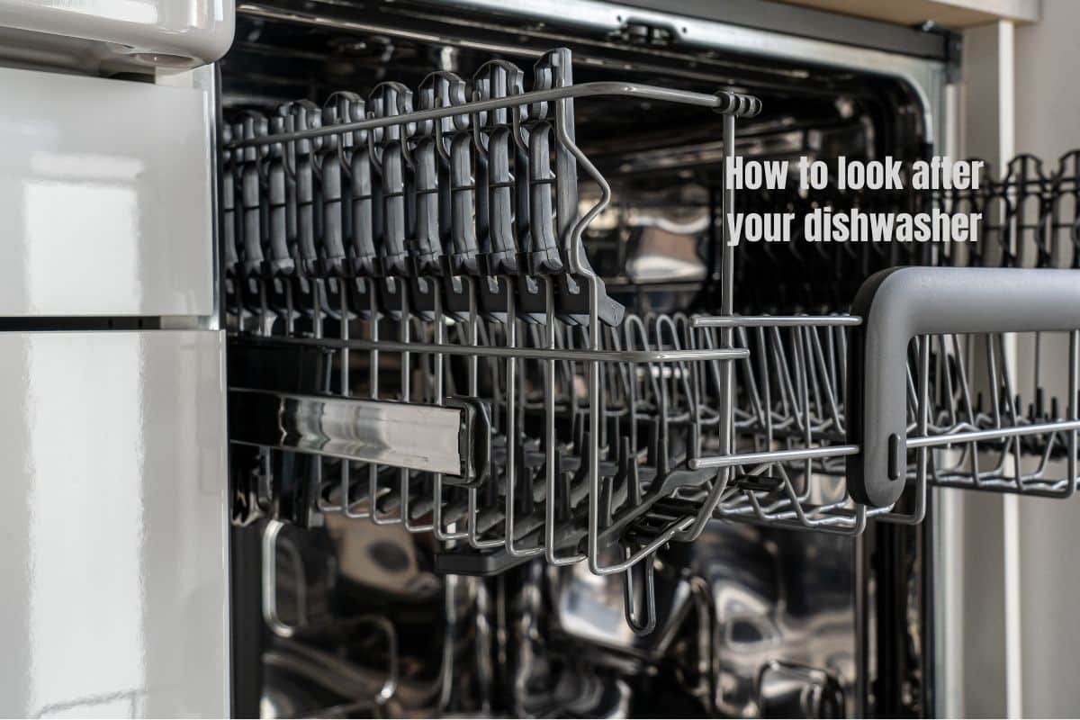 a close up of the top rack of an empty dishwasher