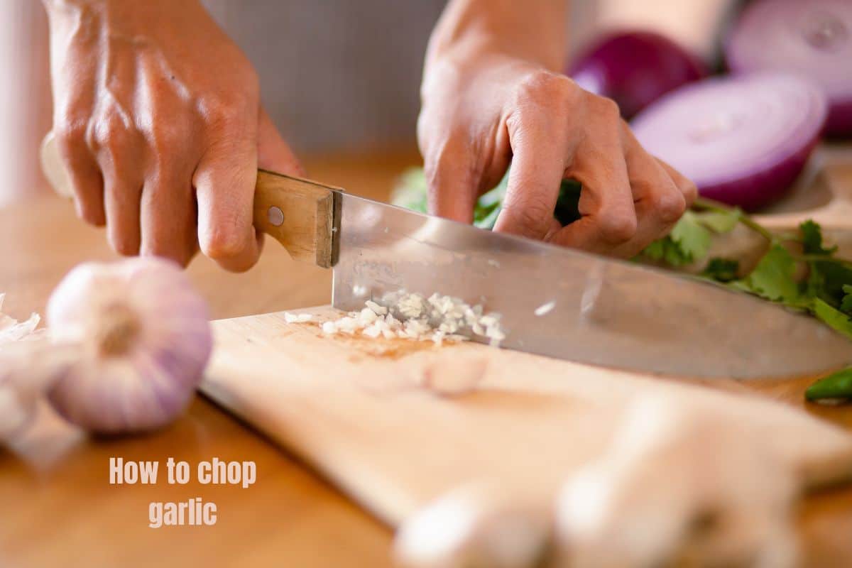 finely chopping garlic with a chef's knife