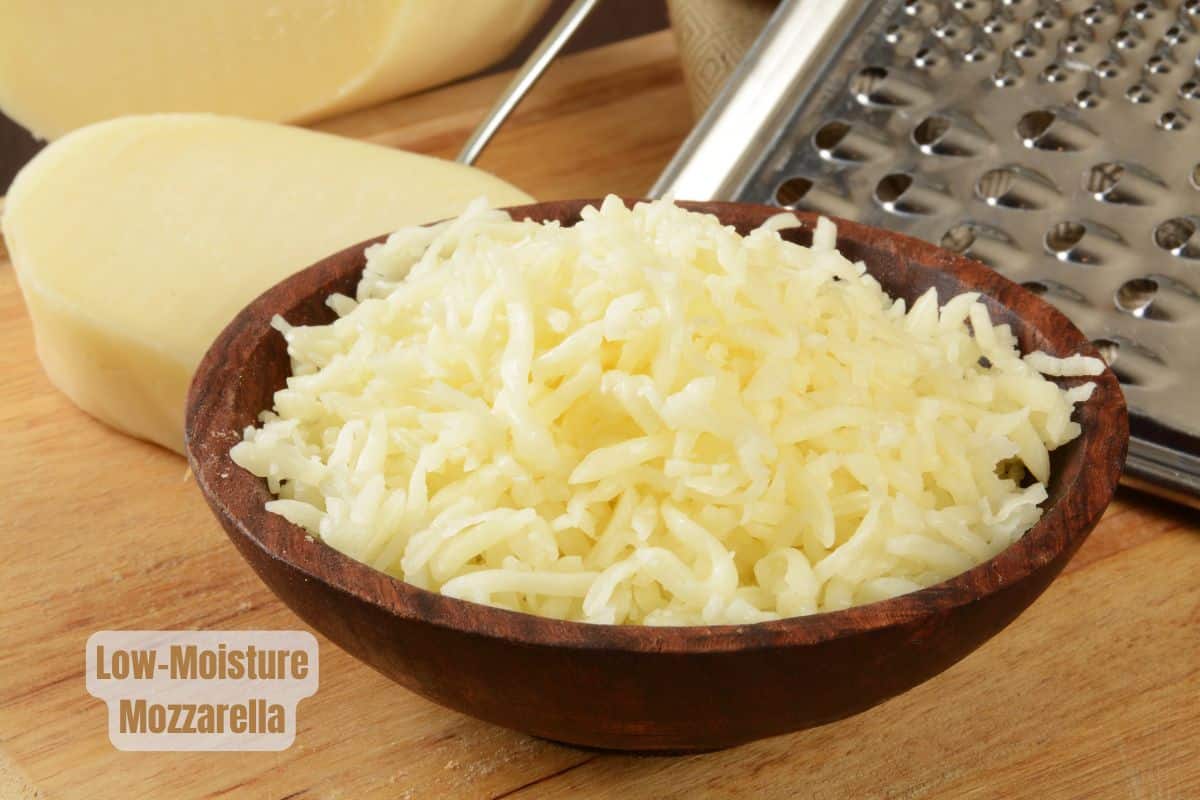 a bowl of grated mozzarella cheese