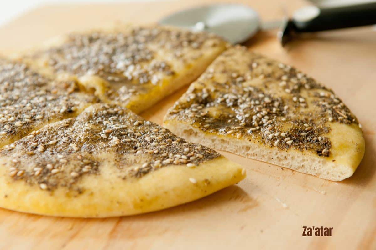 a sliced flatbread topped with za'atar