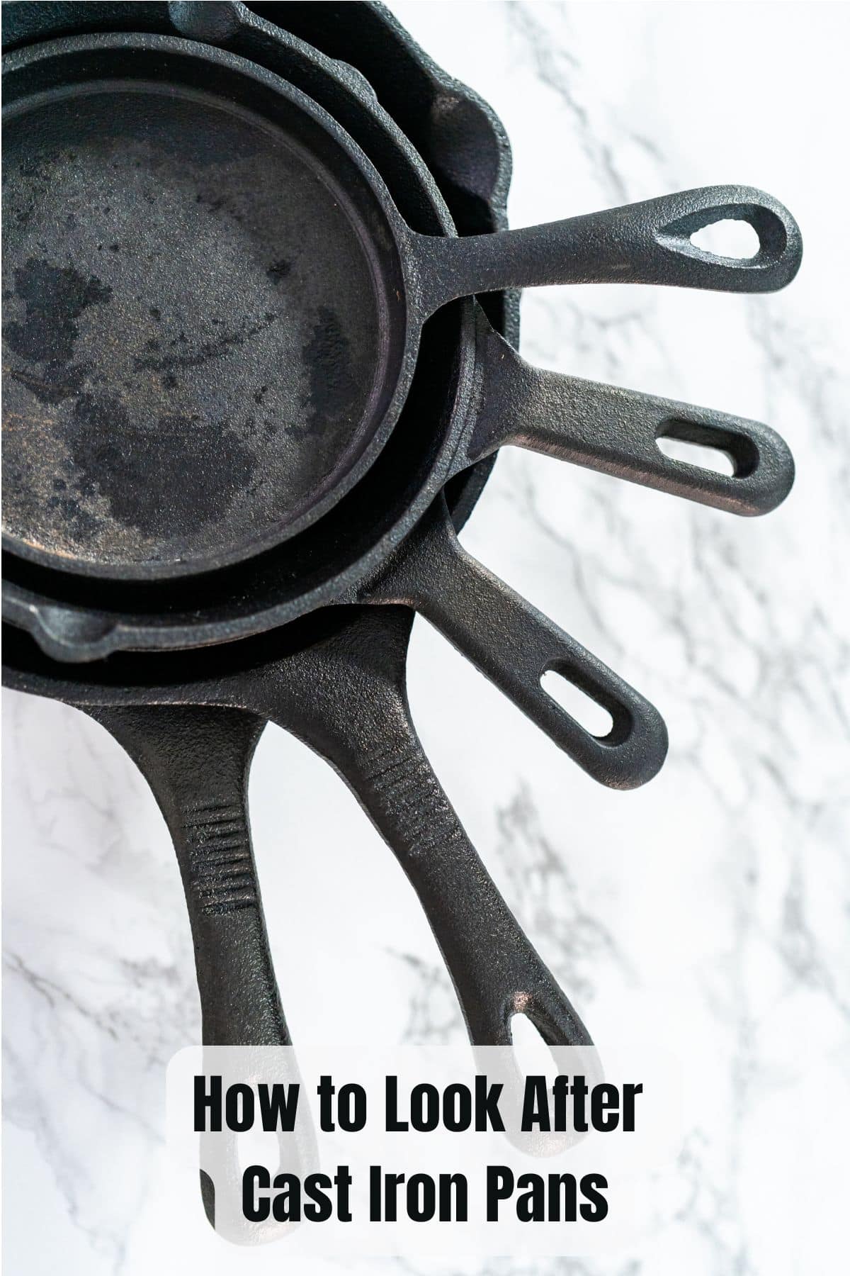 a stack of 5 cast iron frying pans
