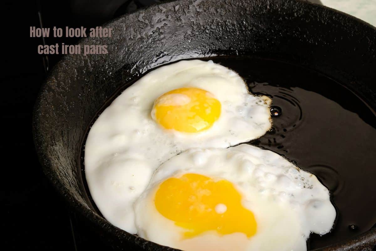 two fried eggs cooked in a cast iron pan
