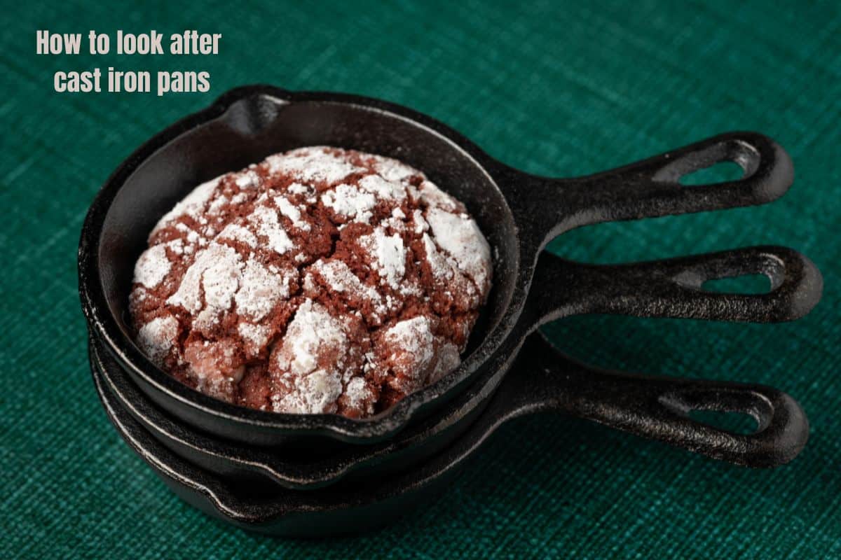 a sack of 3 small cast iron frying pans, the top one contains a chocolate cookie