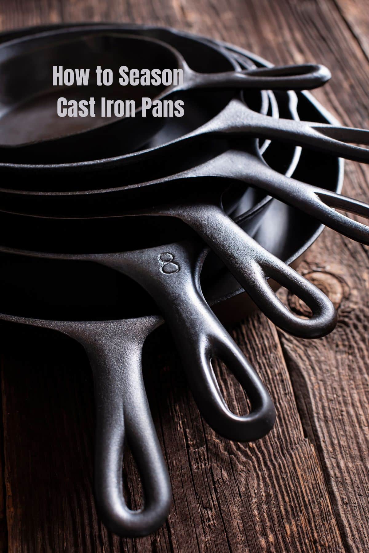 a stack of 6 cast iron skillets